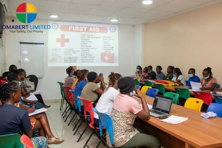 Participants taking notes during a first aid training session